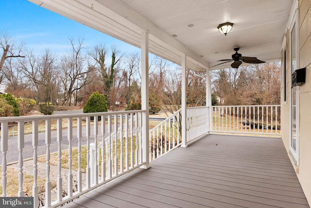 wooden deck with ceiling fan and covered porch