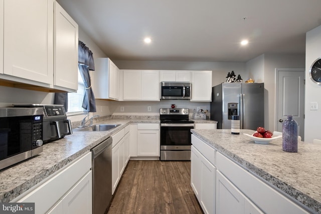 kitchen featuring sink, white cabinetry, and stainless steel appliances