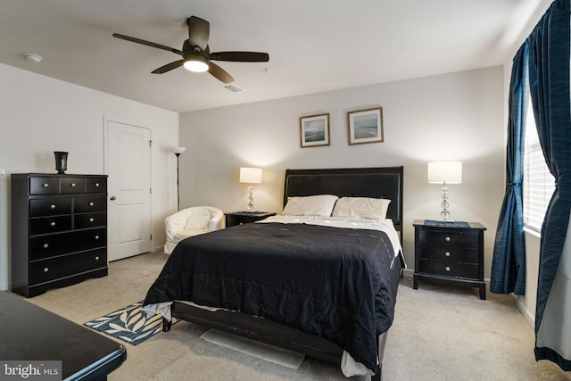 carpeted bedroom featuring ceiling fan