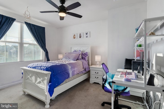 carpeted bedroom with ceiling fan