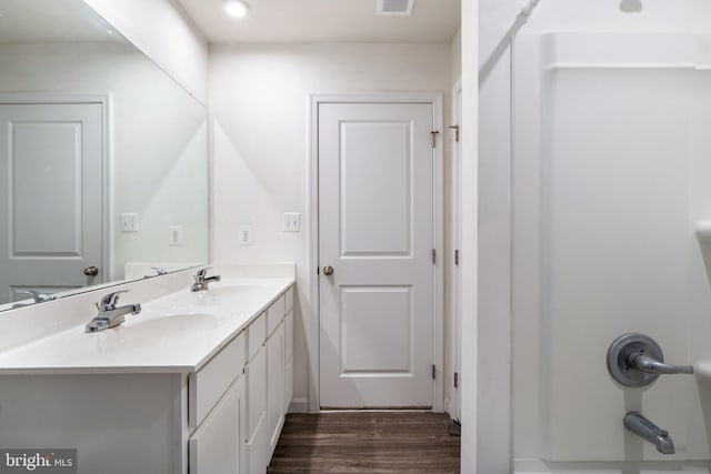 bathroom featuring vanity and hardwood / wood-style flooring