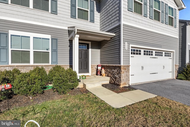 view of exterior entry featuring a garage