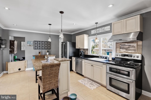 kitchen with stainless steel appliances, sink, exhaust hood, dark stone countertops, and a breakfast bar area