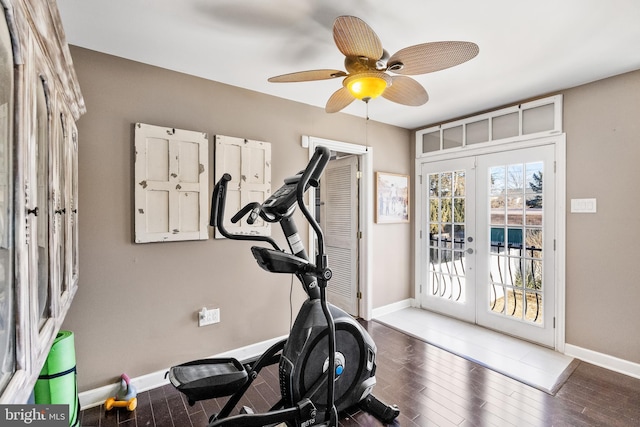 workout area featuring french doors, ceiling fan, and dark wood-type flooring