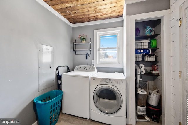 laundry room featuring washing machine and dryer, wood ceiling, and ornamental molding