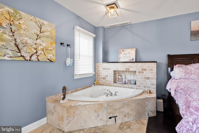 bathroom with tiled bath