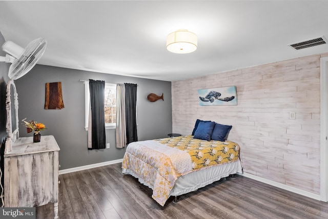 bedroom featuring dark wood-type flooring