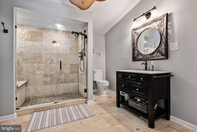 bathroom featuring ceiling fan, toilet, vanity, and tiled shower