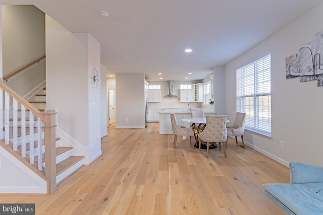 dining area featuring light hardwood / wood-style floors and sink