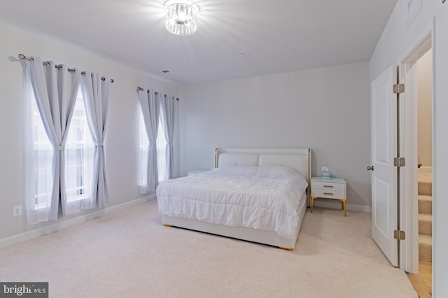 bedroom with light carpet