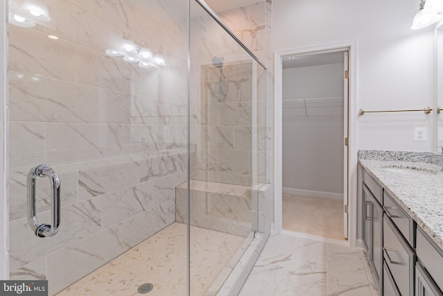 bathroom featuring vanity and walk in shower