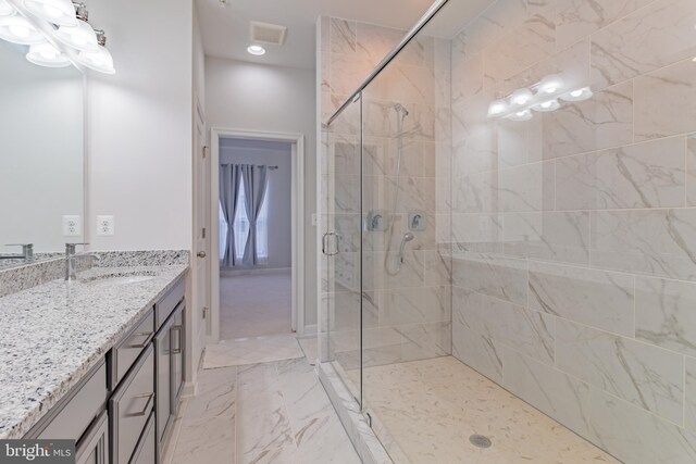 627 Halsey Way, Oxon Hill, MD 20745 - bathroom with a stall shower, vanity, marble look tiles, and recessed lighting