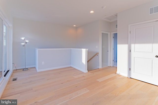 unfurnished room featuring light hardwood / wood-style floors