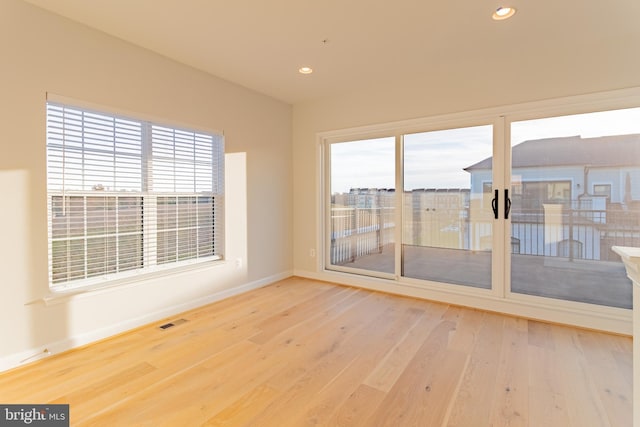 spare room featuring hardwood / wood-style floors