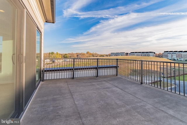 view of patio featuring a balcony