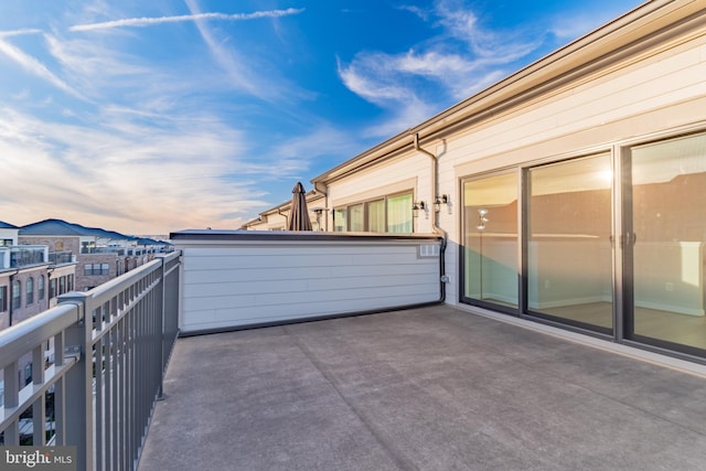 patio terrace at dusk with a balcony