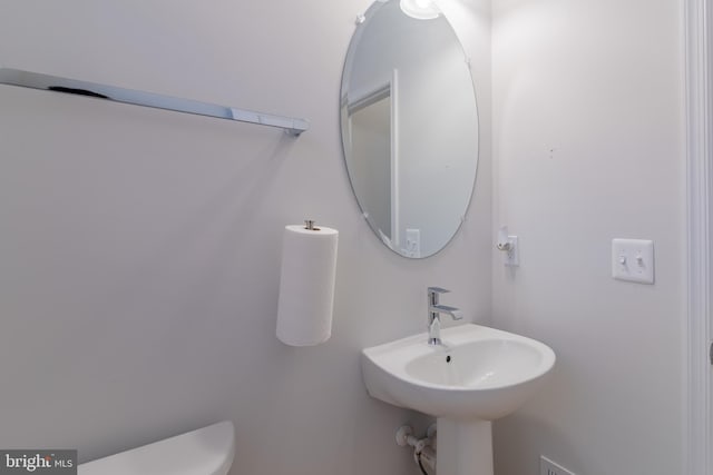 bathroom with toilet and sink