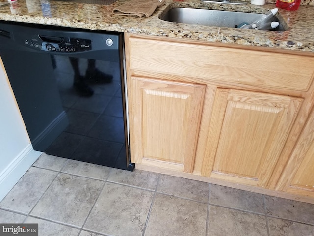 room details featuring sink, light brown cabinetry, light stone counters, and black dishwasher