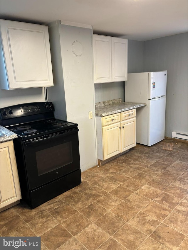 kitchen featuring black electric range, white refrigerator, white cabinets, and light stone counters