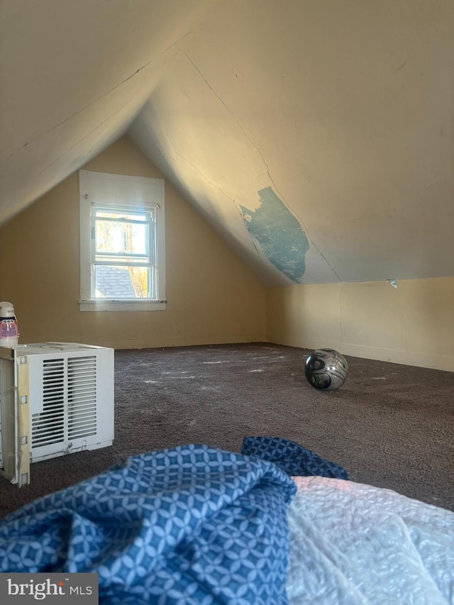 bonus room featuring carpet floors and vaulted ceiling