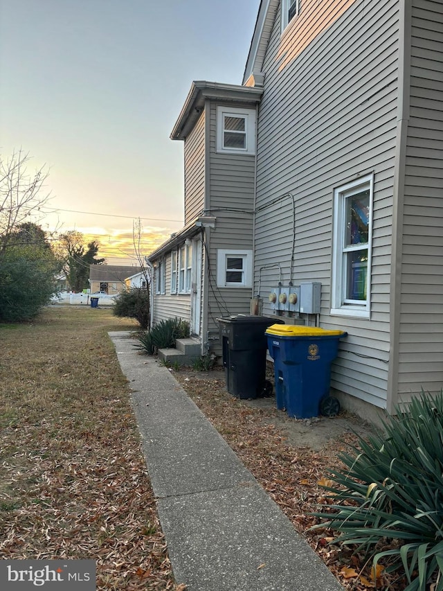 view of property exterior at dusk