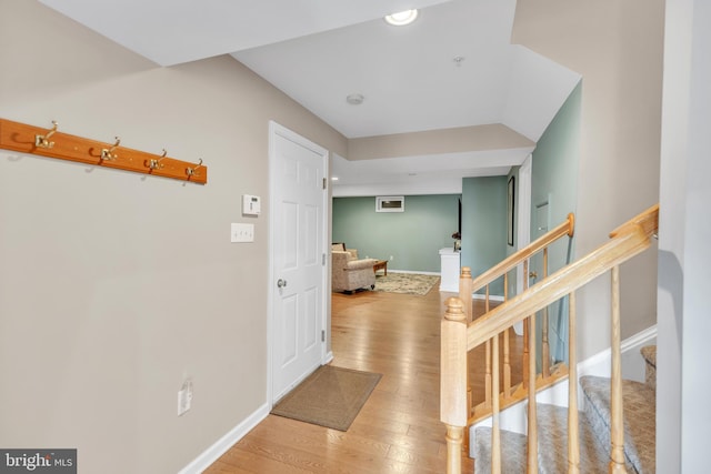 corridor with wood-type flooring