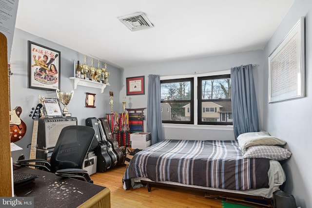 bedroom featuring wood-type flooring