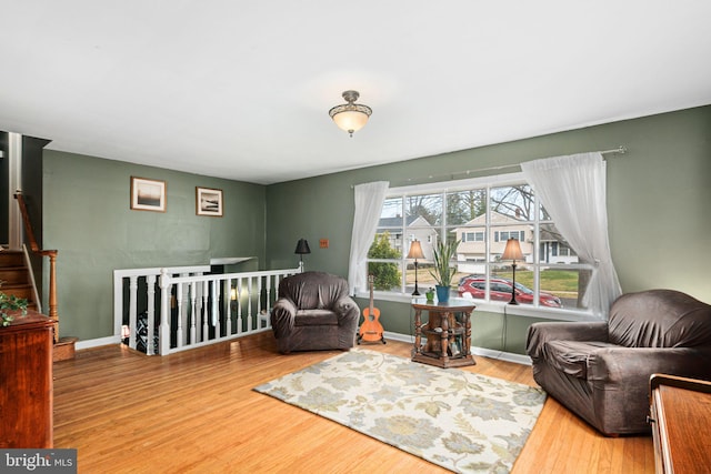 sitting room featuring hardwood / wood-style floors