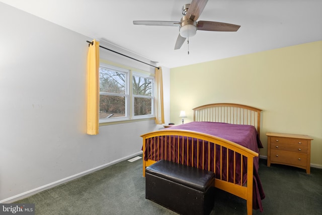 bedroom with dark colored carpet and ceiling fan