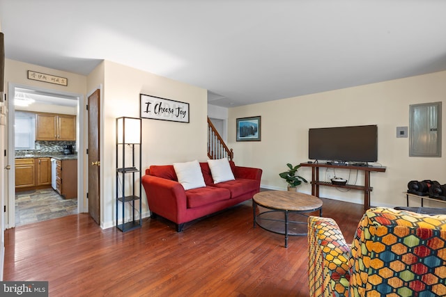 living room featuring dark wood-type flooring and electric panel