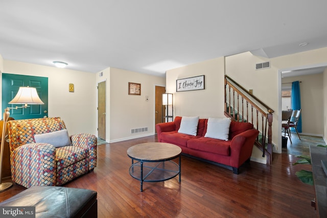 living room featuring dark wood-type flooring