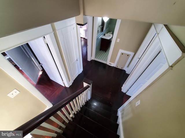 stairs with hardwood / wood-style flooring