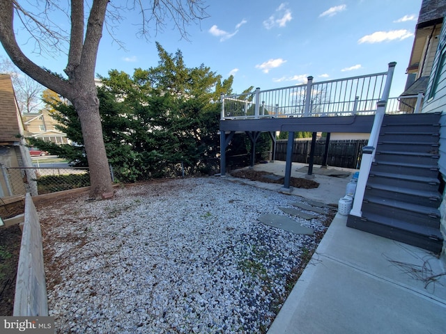 view of yard with a wooden deck