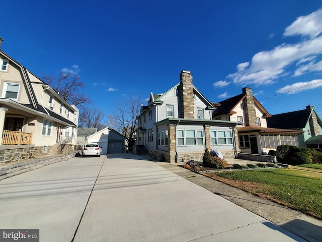 view of home's exterior with an outbuilding and a garage