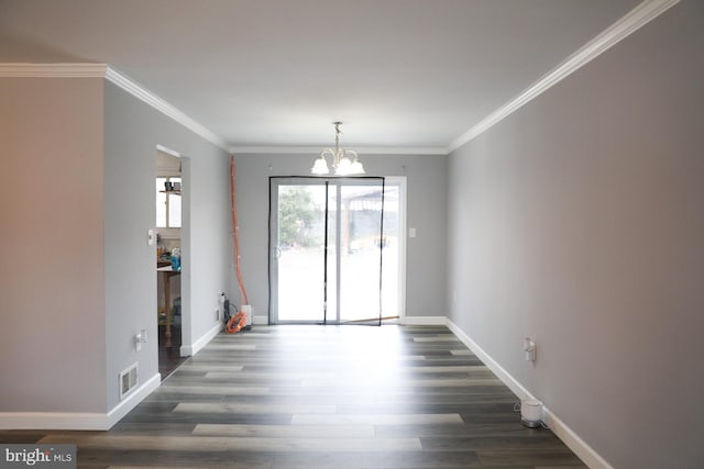 interior space featuring a chandelier, crown molding, and dark hardwood / wood-style floors