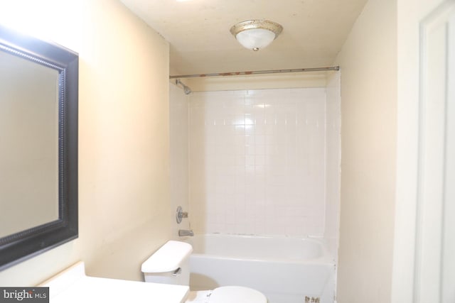 full bathroom featuring vanity, toilet, and tiled shower / bath combo