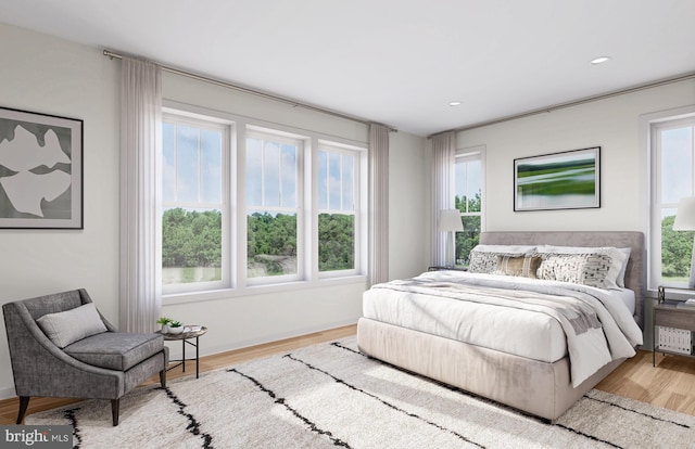 bedroom with light hardwood / wood-style flooring