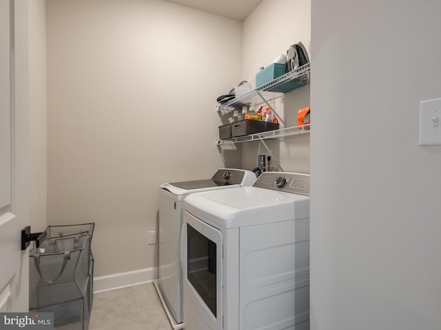 clothes washing area featuring washing machine and dryer