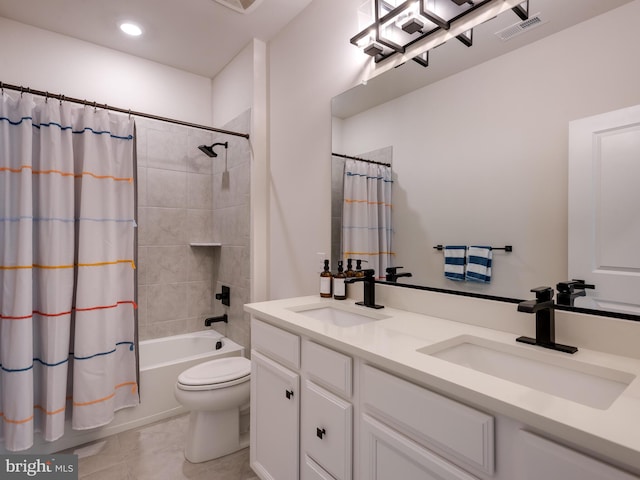 full bathroom featuring tile patterned flooring, vanity, toilet, and shower / tub combo with curtain