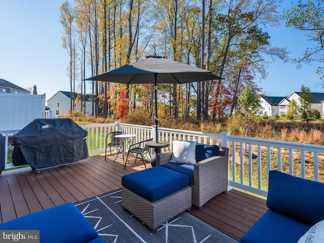 wooden terrace featuring area for grilling