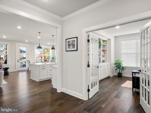 corridor with french doors, dark hardwood / wood-style flooring, and crown molding