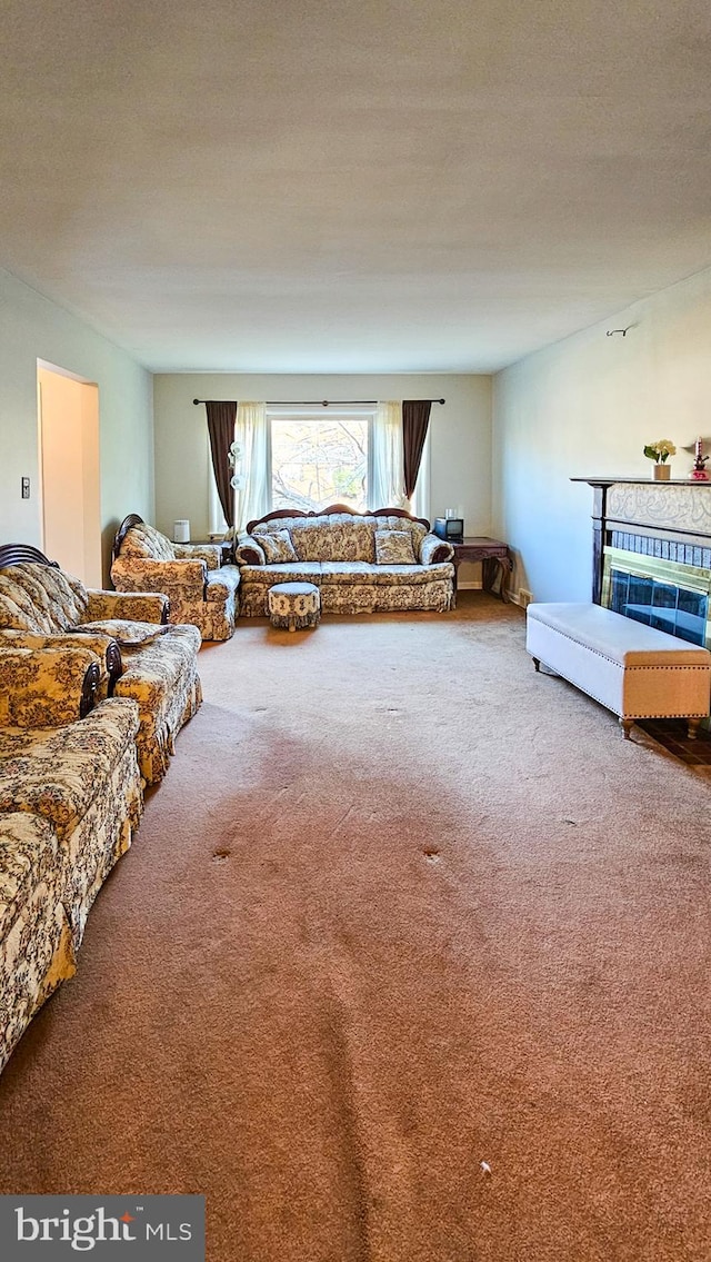 living room with carpet floors and a textured ceiling