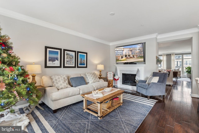 living room with dark hardwood / wood-style floors, crown molding, and a high end fireplace