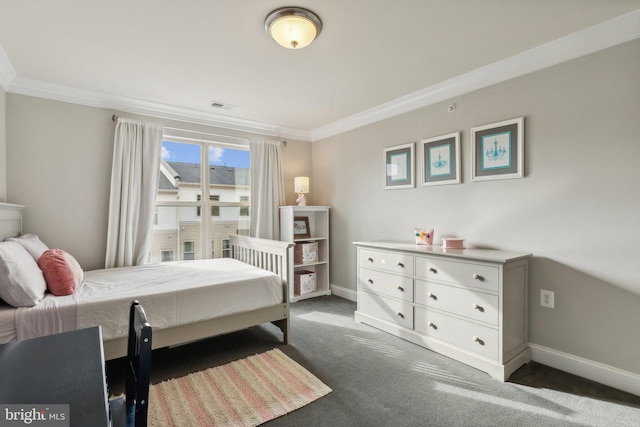 carpeted bedroom featuring crown molding