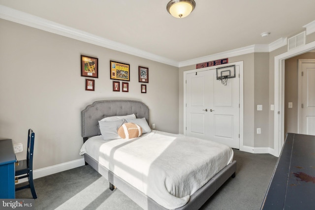 bedroom with dark colored carpet, a closet, and ornamental molding