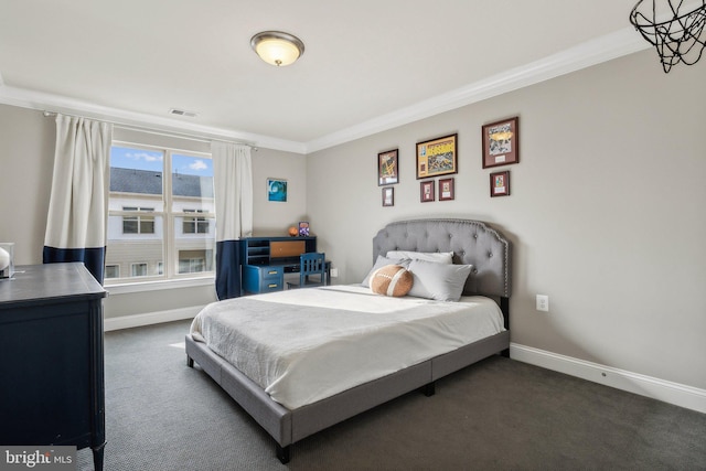 bedroom with dark colored carpet and ornamental molding