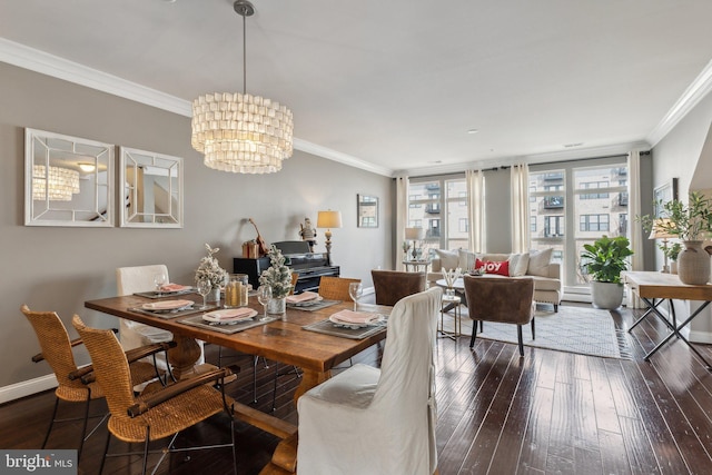 dining space with a chandelier, dark hardwood / wood-style floors, and ornamental molding