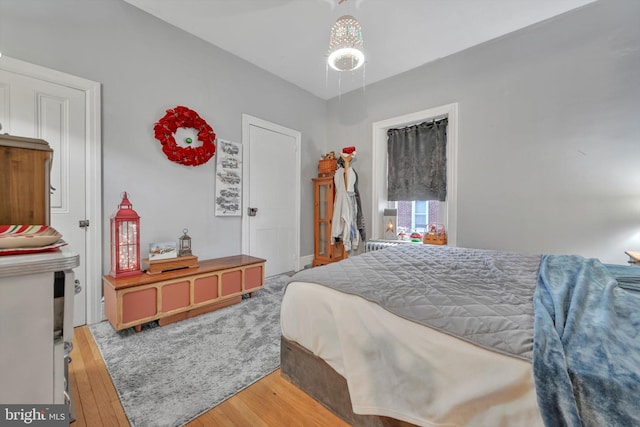 bedroom with hardwood / wood-style flooring