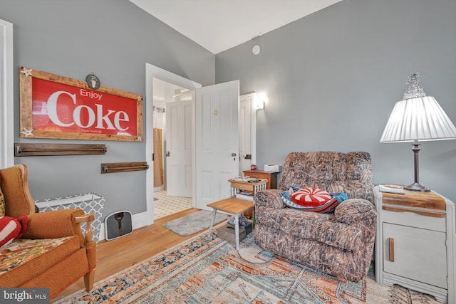 sitting room with wood-type flooring