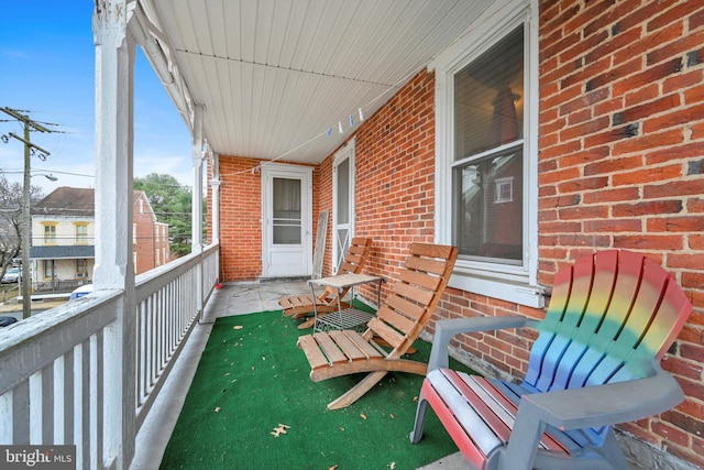 balcony featuring a porch